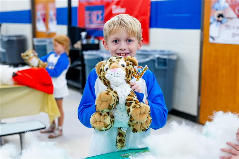 Students build a cheetah at a community event